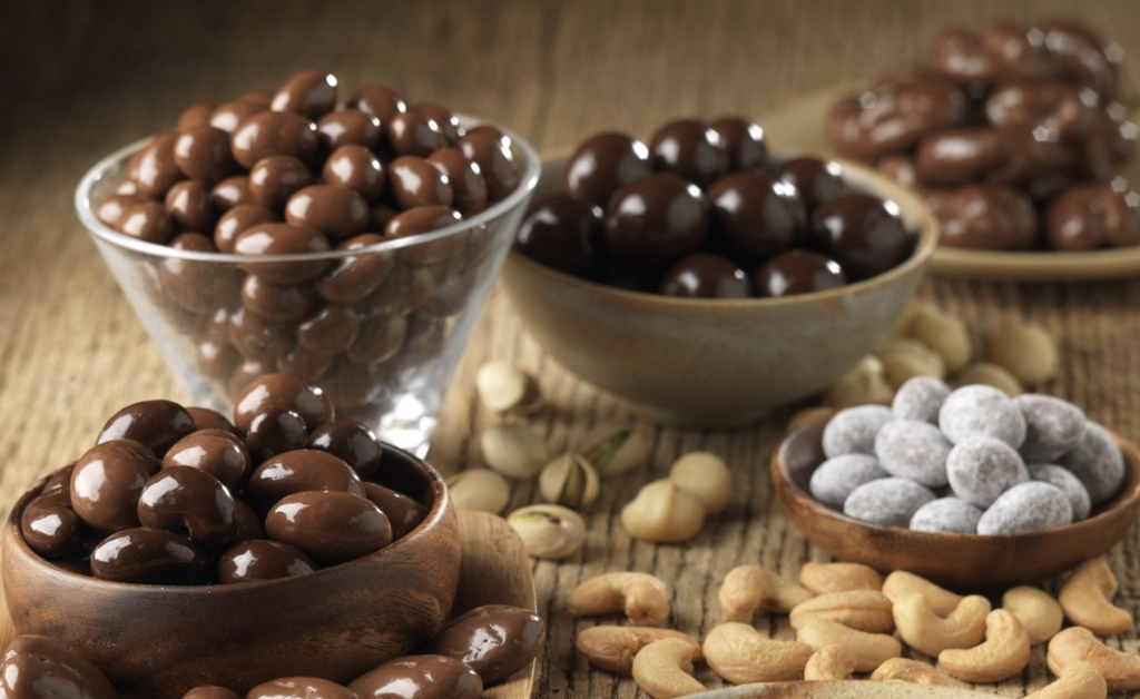 bulk chocolate variety in small wooden bowls